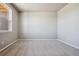 Simple bedroom with neutral wall paint and carpet flooring at 6860 Merseyside Ln, Castle Pines, CO 80108