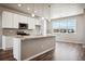 Modern kitchen with granite countertops and stainless steel appliances at 6860 Merseyside Ln, Castle Pines, CO 80108