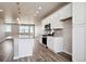 Modern kitchen with granite countertops, stainless steel appliances, and an island at 6860 Merseyside Ln, Castle Pines, CO 80108