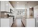 Modern kitchen with granite countertops, stainless steel appliances, and an island at 6860 Merseyside Ln, Castle Pines, CO 80108