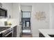 View from kitchen with modern appliances looking out to a small balcony area at 1238 N Tennyson St, Denver, CO 80204