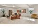 Spacious basement with comfortable seating, movie posters, and bright, natural light from large windows at 4478 Riviera Ct, Aurora, CO 80019