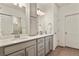 Bathroom with dual sinks, modern fixtures, and ample counter space at 4478 Riviera Ct, Aurora, CO 80019