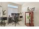 Bright home office with a computer desk, houseplants, and a clerestory window for natural light at 4478 Riviera Ct, Aurora, CO 80019