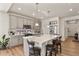 Well-lit kitchen featuring an island with seating, and modern appliances at 4478 Riviera Ct, Aurora, CO 80019