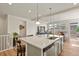 Bright kitchen featuring an island with seating, and an open layout to the living area at 4478 Riviera Ct, Aurora, CO 80019