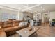 Living room and kitchen area with hardwood floors and stainless steel appliances at 4478 Riviera Ct, Aurora, CO 80019