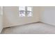 Empty bedroom with plush carpet flooring, and natural light at 11453 Autumn Moon St, Littleton, CO 80125
