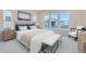 The spacious bedroom is bathed in natural light with a sitting area, creating a cozy retreat for relaxation at 11453 Autumn Moon St, Littleton, CO 80125