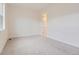 Empty bedroom with plush carpet flooring, neutral walls, and ample space at 11453 Autumn Moon St, Littleton, CO 80125