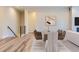 Dining room with modern decor, stylish furnishings, and lots of natural light from an open floor plan at 11453 Autumn Moon St, Littleton, CO 80125