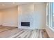 Living room featuring modern fireplace and hardwood floors at 11453 Autumn Moon St, Littleton, CO 80125