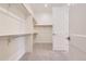 A walk-in closet provides ample storage space with multiple rods and shelves for easy organization at 11453 Autumn Moon St, Littleton, CO 80125