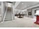 Basement with game area, full stairs to upper floor, and backyard access at 3266 Coyote Hills Way, Castle Rock, CO 80109