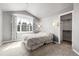 Neutral bedroom featuring a large window, carpeted floor, and ensuite closet at 3266 Coyote Hills Way, Castle Rock, CO 80109