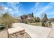 Stunning two-story home with a three-car garage and beautifully manicured front yard at 3266 Coyote Hills Way, Castle Rock, CO 80109