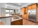 Modern kitchen features stainless steel appliances, granite countertops, and custom cabinetry at 3266 Coyote Hills Way, Castle Rock, CO 80109