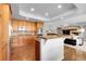 Bright, open kitchen featuring a large island and seamless flow into the living space at 3266 Coyote Hills Way, Castle Rock, CO 80109