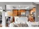 Open kitchen with a breakfast bar, stainless steel appliances, and plenty of cabinet space, seamlessly connected to the living area at 3266 Coyote Hills Way, Castle Rock, CO 80109