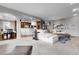 Spacious living room with hardwood floors, an open floor plan, and natural light at 3266 Coyote Hills Way, Castle Rock, CO 80109