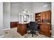 Well-appointed home office with built-in shelving and ample workspace at 3266 Coyote Hills Way, Castle Rock, CO 80109