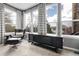 Cozy sitting area with large windows providing natural light and neighborhood views at 3266 Coyote Hills Way, Castle Rock, CO 80109