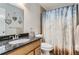 Bathroom featuring modern fixtures and a shower-tub combo at 7700 W Glasgow Pl # 6C, Littleton, CO 80128