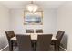 Formal dining room featuring a large table and ornate mirror detail at 7700 W Glasgow Pl # 6C, Littleton, CO 80128