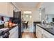 Efficient kitchen design overlooking the dining area. Clean lines and stainless appliances at 7700 W Glasgow Pl # 6C, Littleton, CO 80128