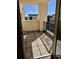 Open-air balcony features wrought iron railing overlooking city with concrete flooring; a serene retreat at 300 W 11Th Ave # 8C, Denver, CO 80204