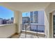 This balcony with metal railing showcases city views with construction; an ideal outdoor living space at 300 W 11Th Ave # 8C, Denver, CO 80204
