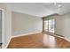 Light-filled room with hardwood floors, a private balcony, and neutral colored walls at 300 W 11Th Ave # 8C, Denver, CO 80204