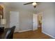 A versatile bedroom includes a ceiling fan and an open doorway that provides easy access to other areas at 4825 S Delaware St, Englewood, CO 80110