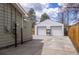 Exterior view of the two-car detached garage, offering ample parking and storage space at 4825 S Delaware St, Englewood, CO 80110
