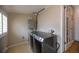 Practical laundry room with modern washer and dryer set, providing a functional space for laundry tasks at 4825 S Delaware St, Englewood, CO 80110