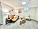 Cozy basement featuring neutral walls, contemporary furniture, and plenty of room for relaxation at 7901 Newport St, Commerce City, CO 80022