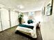 Bright bedroom featuring comfortable bedding, ample natural light, and closet space at 7901 Newport St, Commerce City, CO 80022
