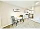 Cozy dining area beside the kitchen, featuring a small table and chairs for intimate meals at 7901 Newport St, Commerce City, CO 80022