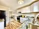 Open kitchen with granite counters, stainless steel appliances, and views of the dining area at 7901 Newport St, Commerce City, CO 80022
