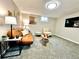 Comfortable living area with a leather sofa, decorative pillows, and modern furniture at 7901 Newport St, Commerce City, CO 80022
