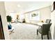 Bright living room featuring neutral tones, plush carpet, and stylish decor for a welcoming atmosphere at 7901 Newport St, Commerce City, CO 80022