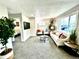 Spacious living room boasts bright windows and comfortable seating at 7901 Newport St, Commerce City, CO 80022