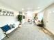 Inviting living room with neutral walls, plush carpeting, and a cozy seating arrangement at 7901 Newport St, Commerce City, CO 80022