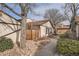 This townhome features a privacy fence, neutral siding, stone accents, and a walkway on a well-maintained lot at 16036 E Ithaca Pl # E, Aurora, CO 80013