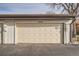 Attached single car garage with traditional panel design at 16036 E Ithaca Pl # E, Aurora, CO 80013