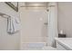 Clean bathroom with white tiling and a shower-tub combination at 11400 W Grand Ave, Littleton, CO 80127