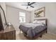 Bedroom with hardwood floors, a large window and a dark wood dresser at 11400 W Grand Ave, Littleton, CO 80127