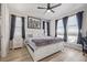 Bright bedroom with hardwood floors, a large window and a king size bed at 11400 W Grand Ave, Littleton, CO 80127