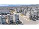 An aerial view of a modern, planned neighborhood with a mountain backdrop at 11400 W Grand Ave, Littleton, CO 80127