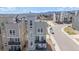View of a modern multi-story townhome and its exterior features at 11400 W Grand Ave, Littleton, CO 80127